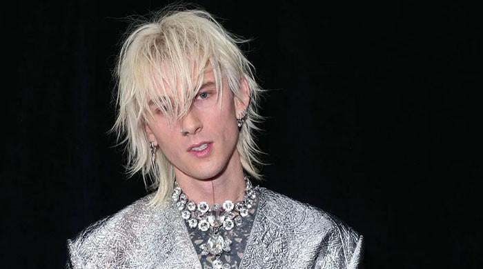 Machine Gun Kelly shares rare glimpse of newborn baby
